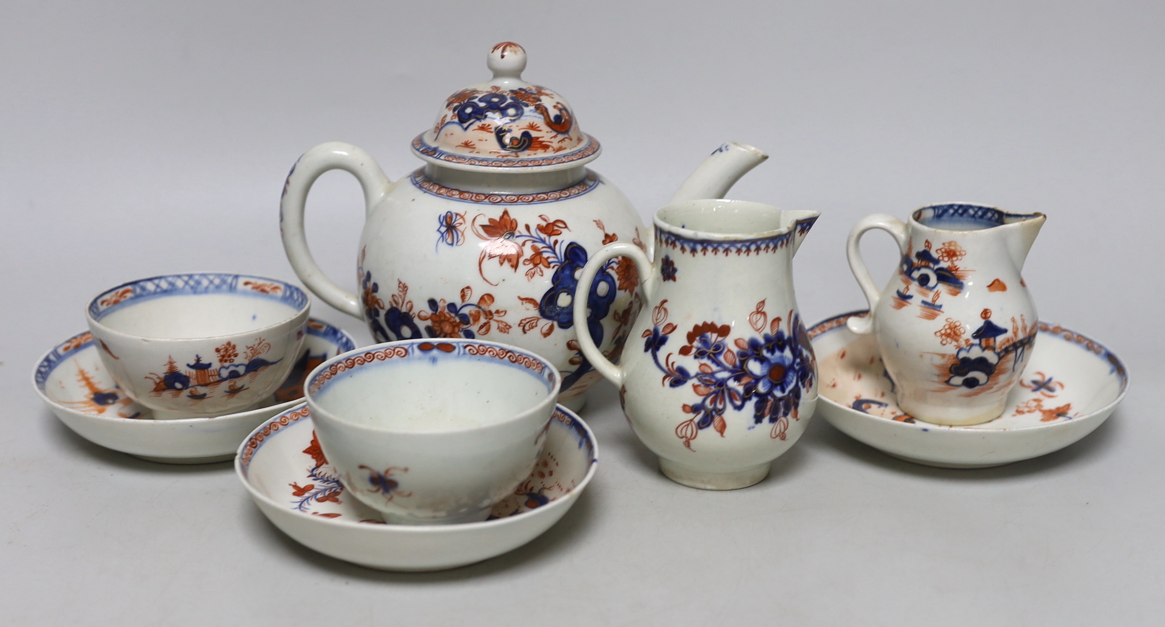 A group of Lowestoft Imari teawares, c.1770, including a Redgrave two bird pattern teapot and cover, tea bowl and two saucers, a Dolls House pattern sparrow beak cream jug and teabowl with saucer and a further sparrow be